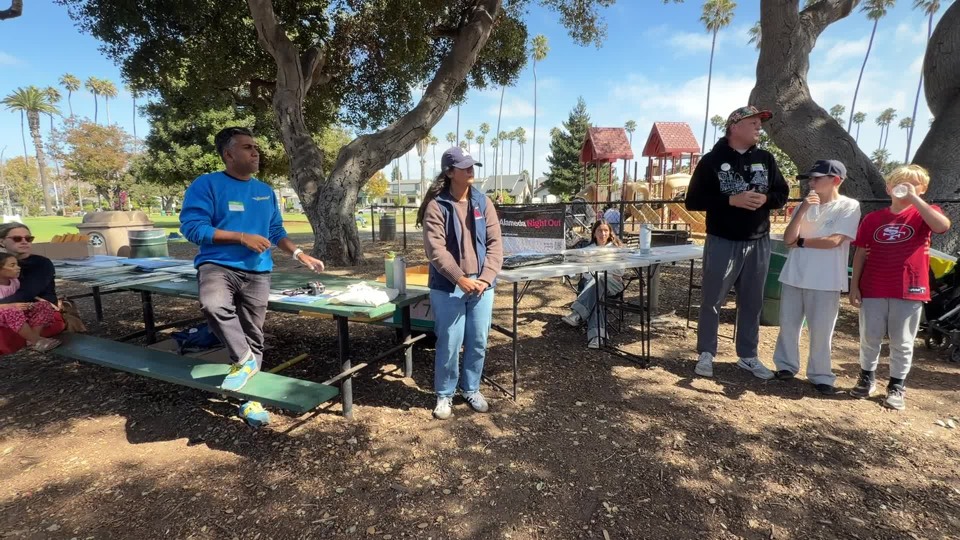 Tyler Savage discussing parks & alameda point at the potluck