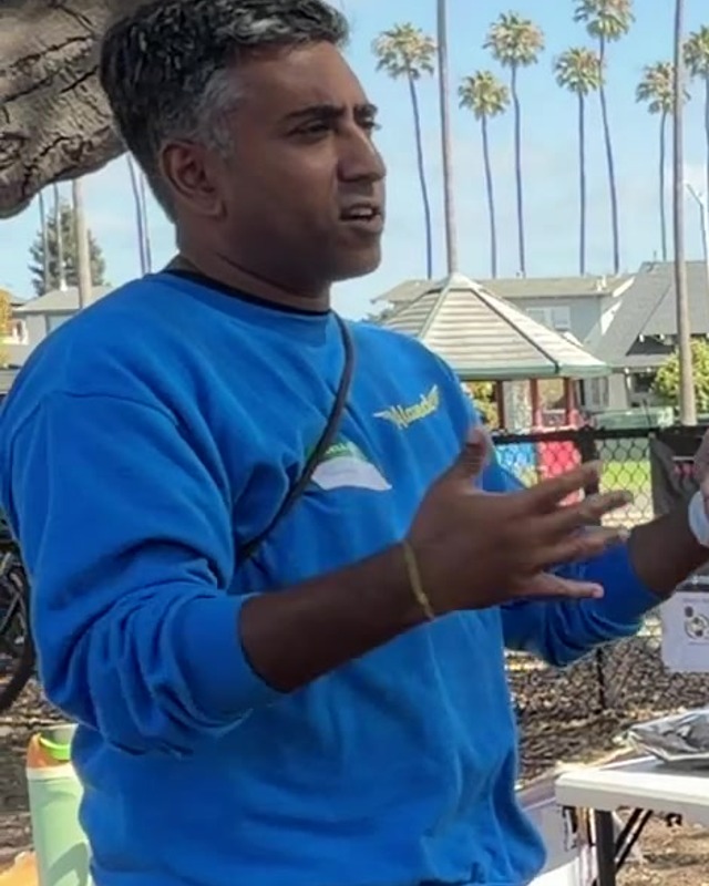 Thushan Amarasiriwardena speaking at the potluck